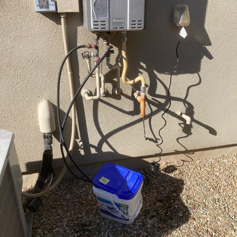 Exterior tankless water heater flushing and filter cleaning