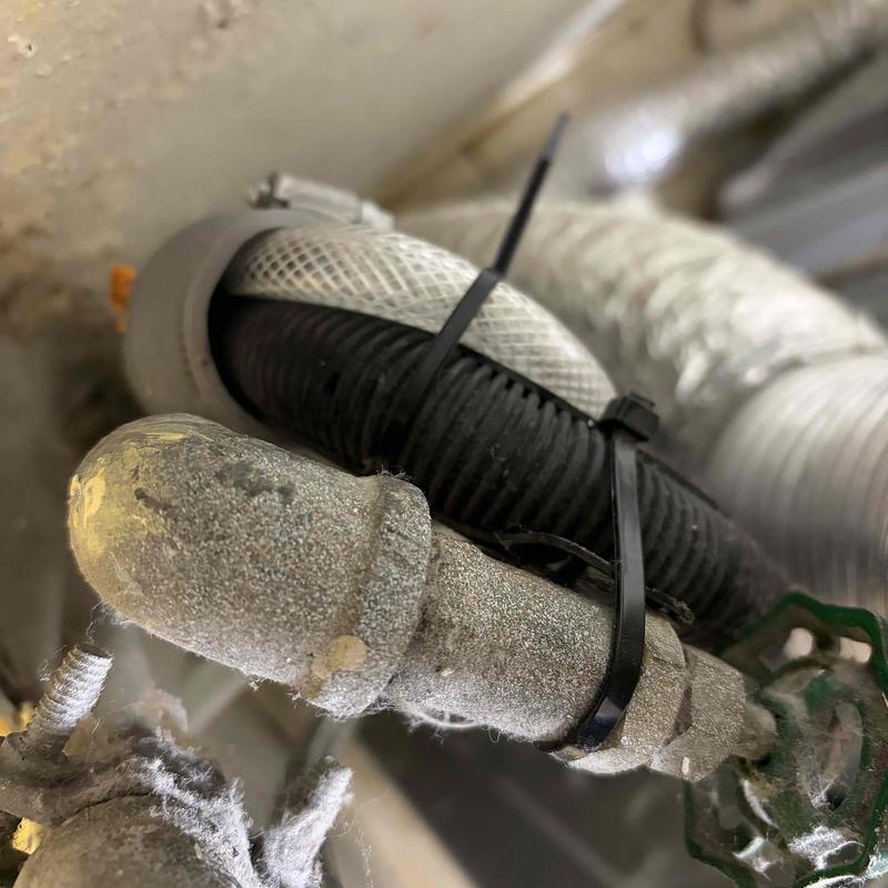 Condensation pump piping with new hose clamps installed