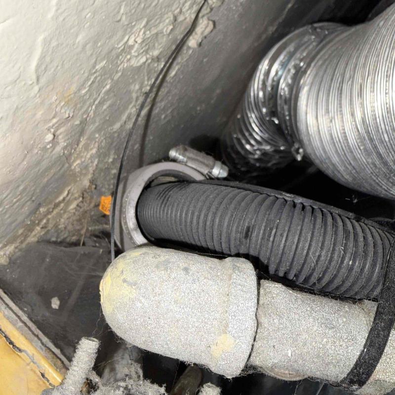 Condensate pump piping with clamps and insulation