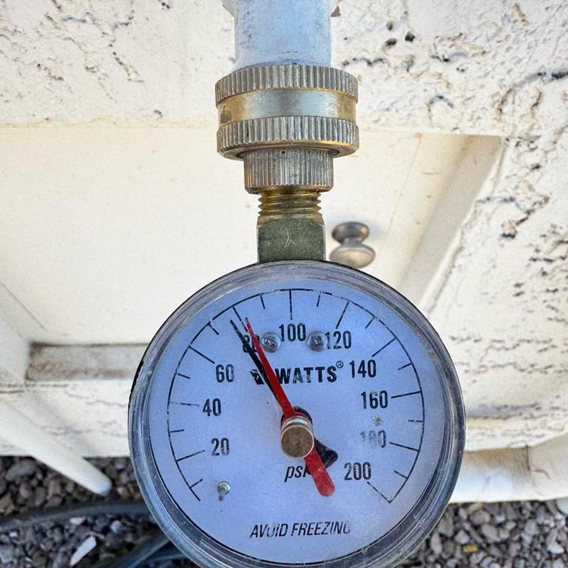 Pressure regulating valve gauge showing water pressure