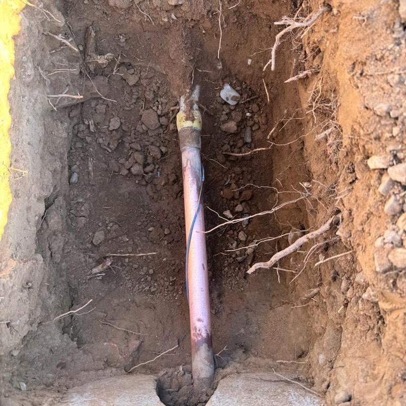 Copper water main pipe with pressure valve installation