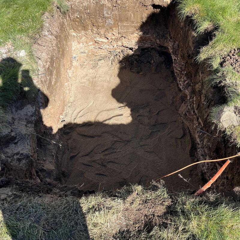Septic system excavation site with prepared soil base
