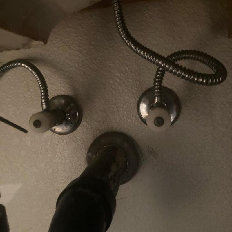 Angle stop valves and plumbing connections under sink