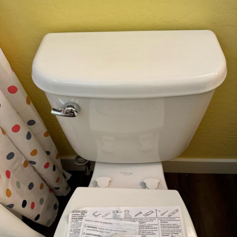 Toilet tank replacement with handle in bathroom Toilet tank replacement with handle in bathroom