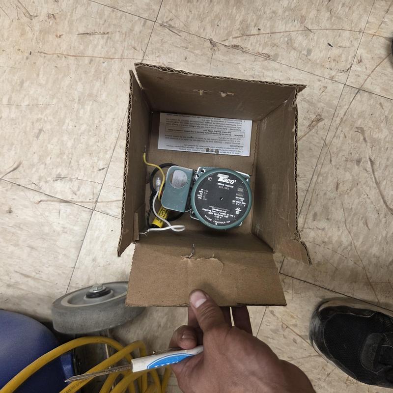 Circulator pump motor in cardboard box with wiring