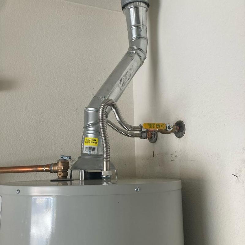 50 gallon gas water heater with new exhaust vent and valves