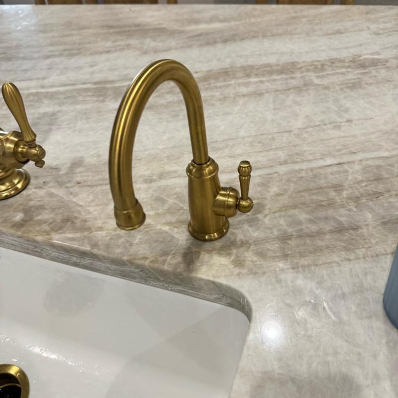 Reverse osmosis faucet with tightened mounting nut on countertop
