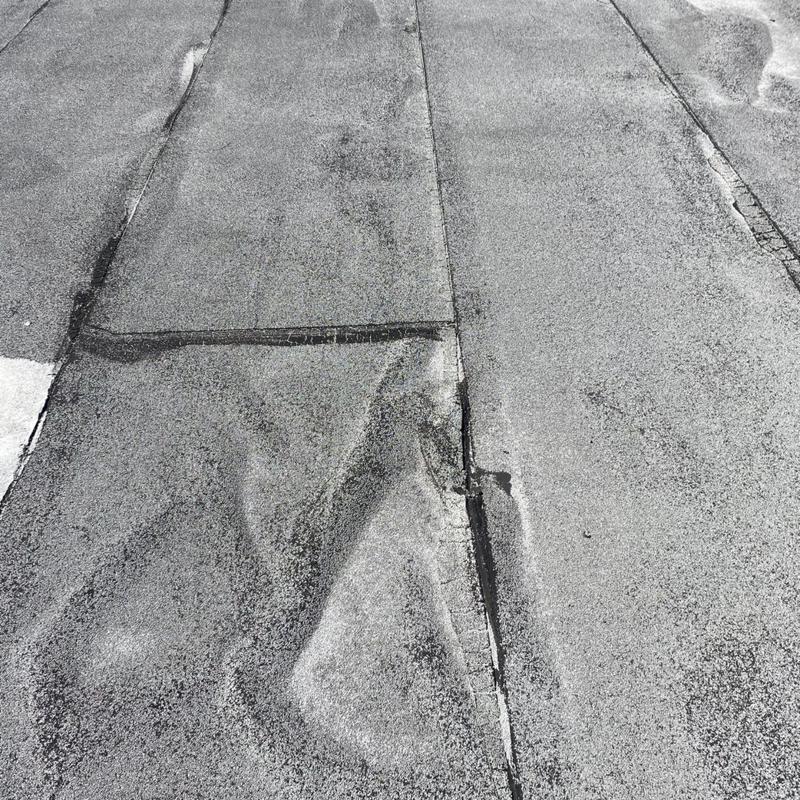 Modified bitumen roof with seam separation damage