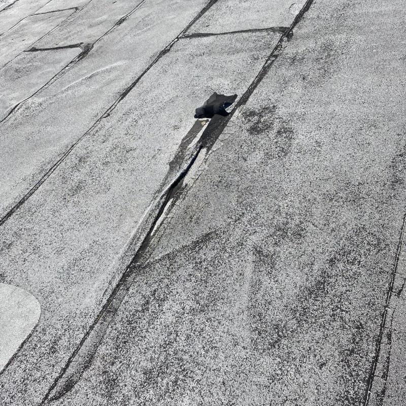 Modified bitumen roof with seam separation and cracking