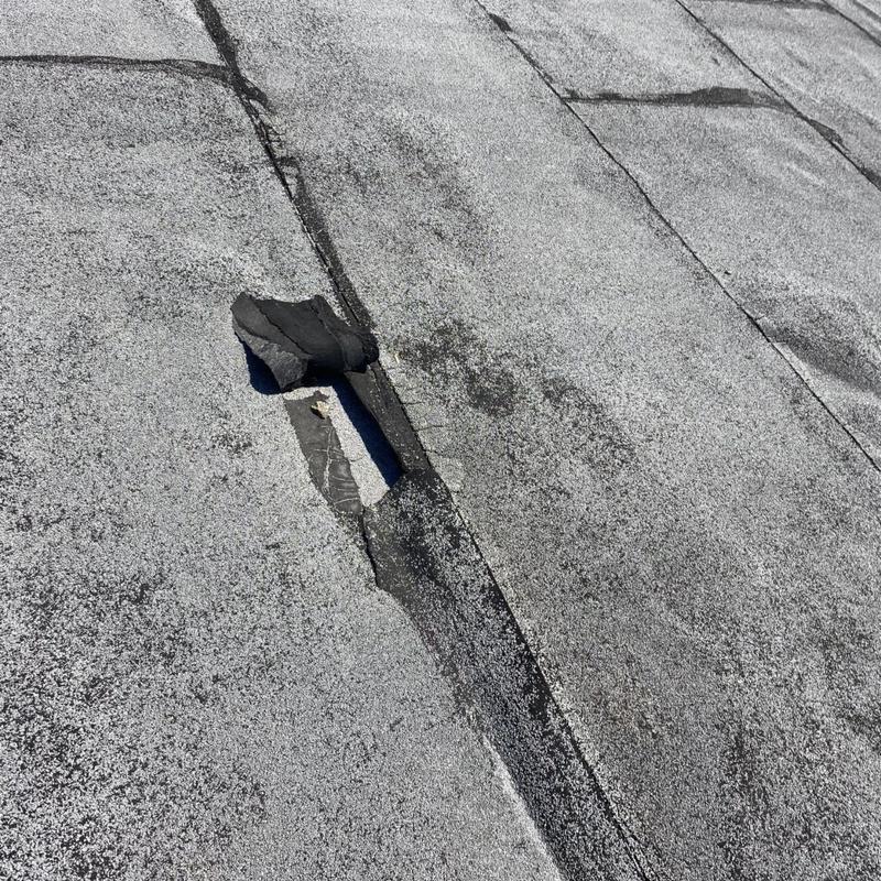 Modified bitumen roof with seam separation and cracking
