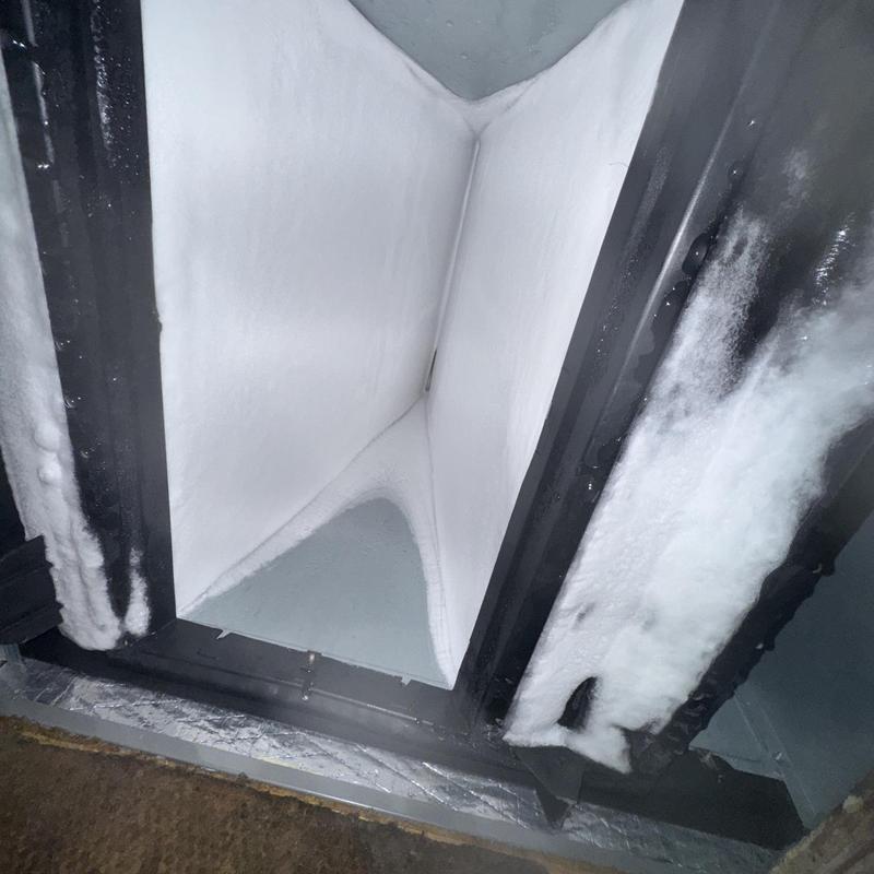Frozen air conditioner evaporator coil buildup inside unit