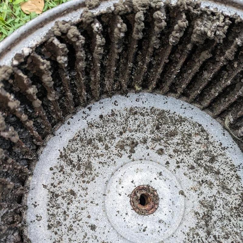Blower wheel clogged with dirt and debris buildup