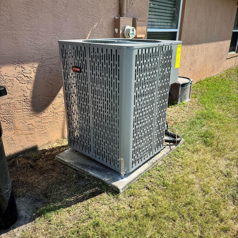 Central air conditioning unit installed outdoors