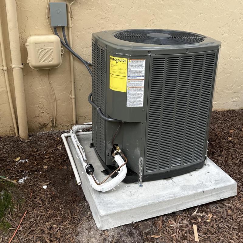 Trane heat pump system on concrete pad outdoors