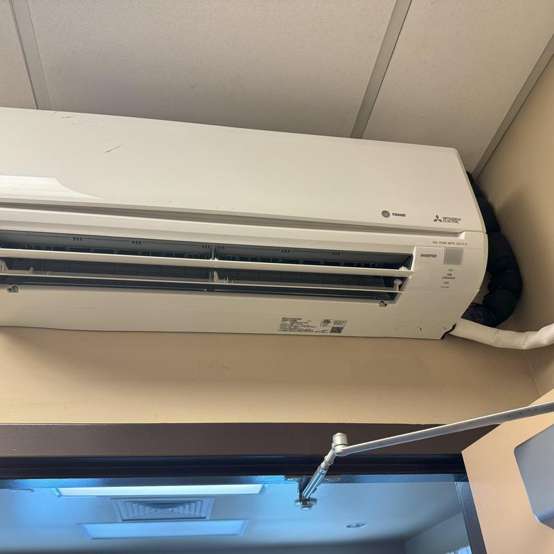 Mini-split air conditioner installed in office wall