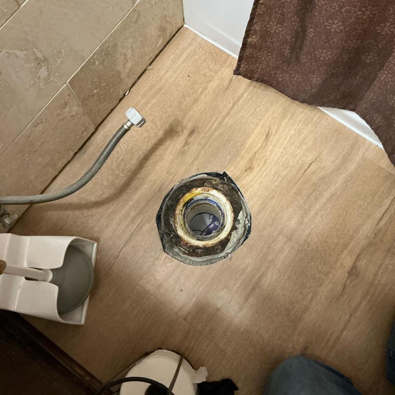 Toilet flange on bathroom floor before installation