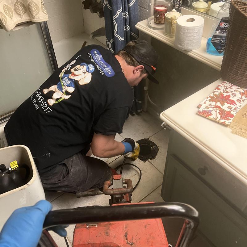 Main sewer line with root removal and drain snaking