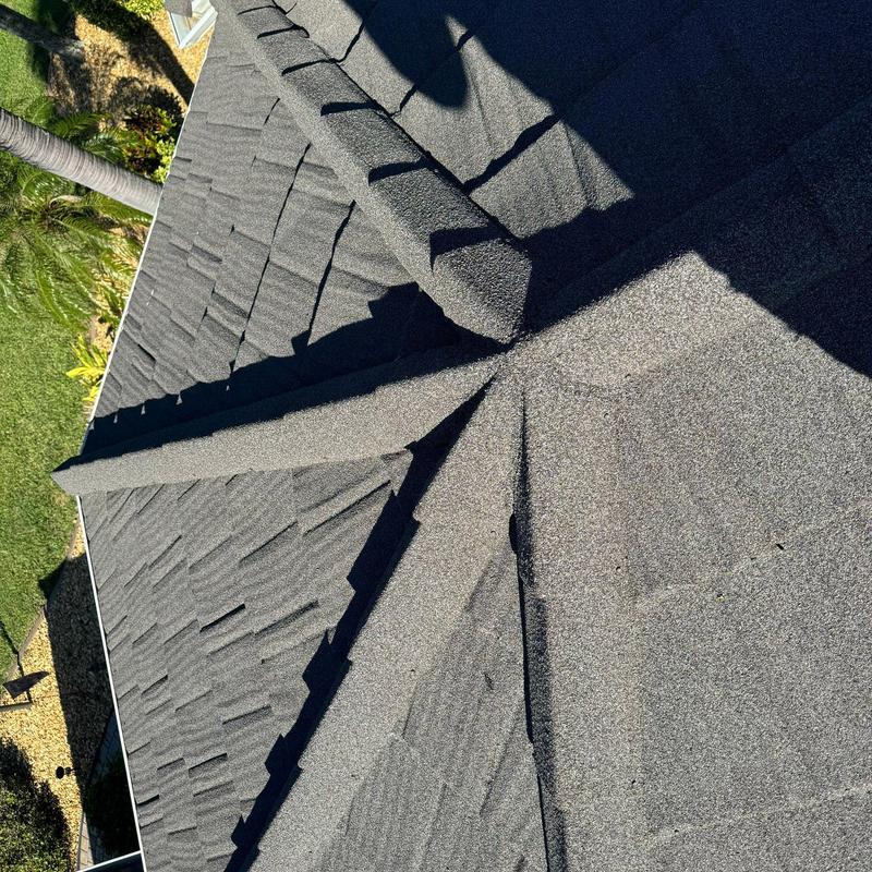 Stonecoated steel roof panels on residential home ridge