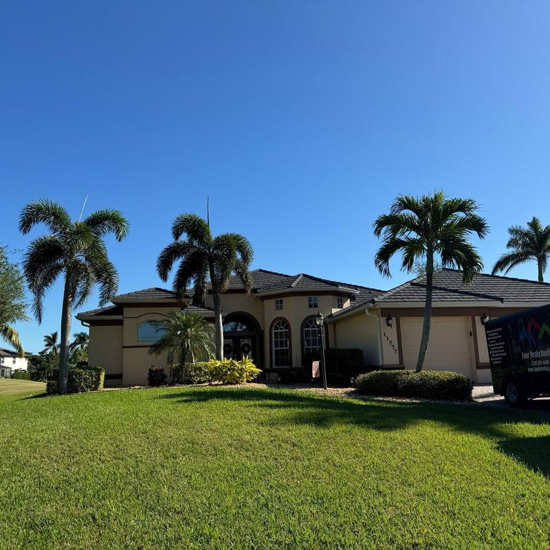 Stonecoated steel roof installation with palm trees