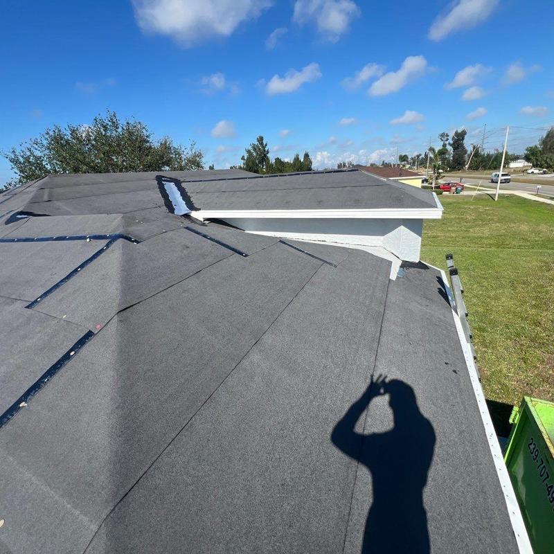 Roof underlayment inspection with UV damage on Cape Coral roof