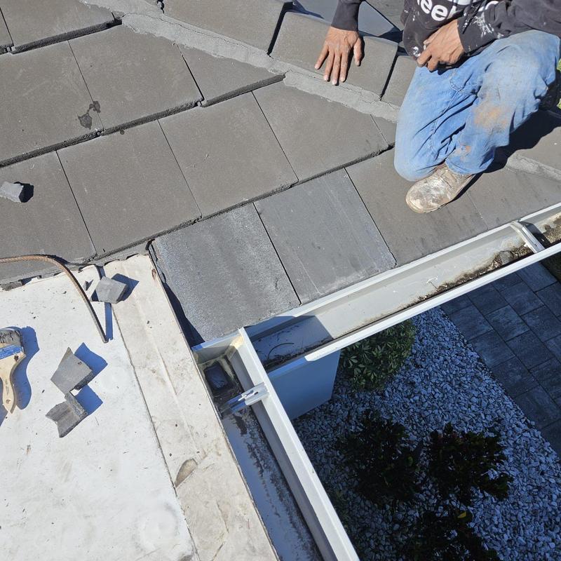 Concrete tile roof with replacement tiles installation