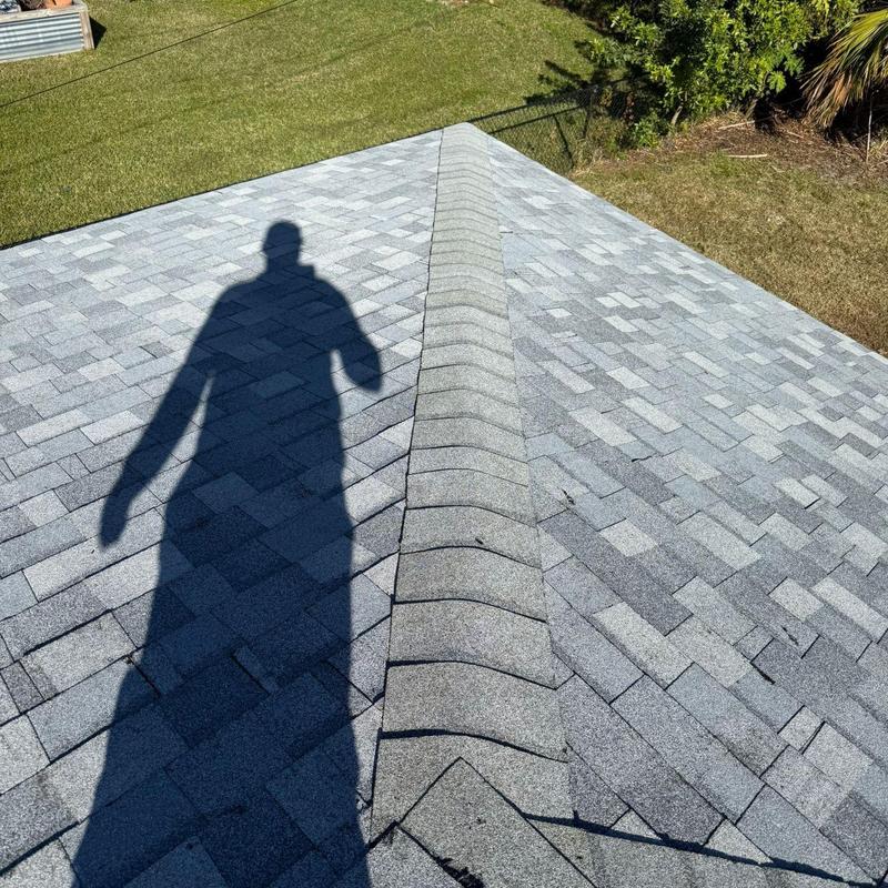 Shingle roof ridge with deteriorated shingles Cape Coral FL