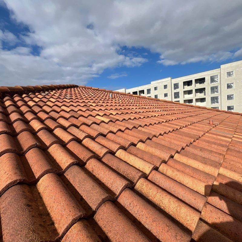 Concrete tile roof with residential building background