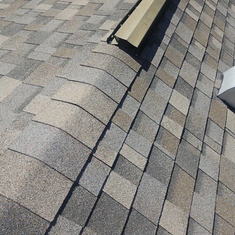 Shingle roof with ridge cap and vent installation