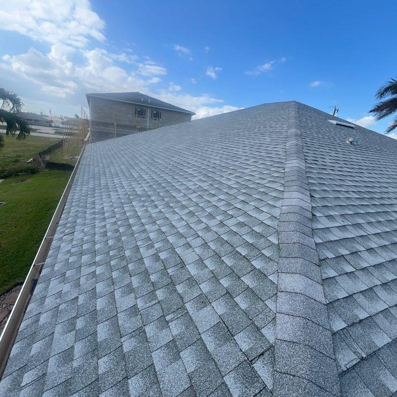 Asphalt shingle roof with clear weather and blue sky