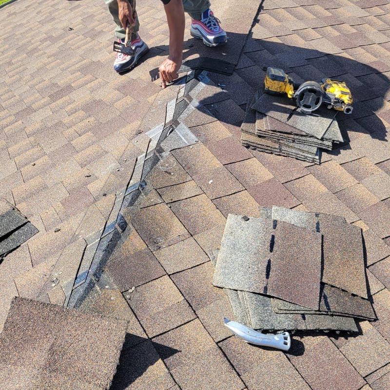 Shingle roof with tools and shingles for repair