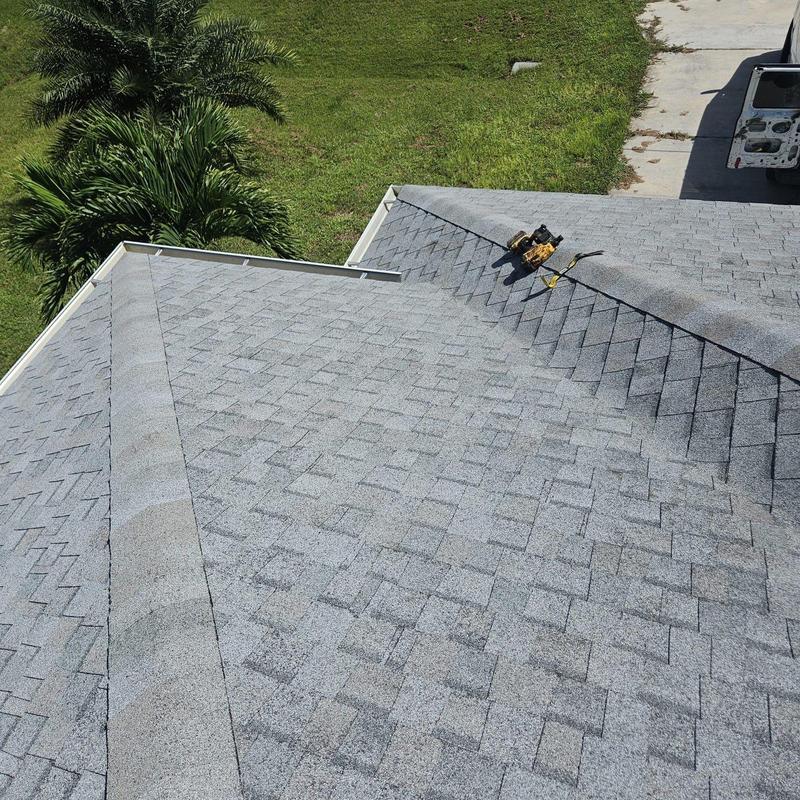 Shingle roof with repair tools on top in Cape Coral