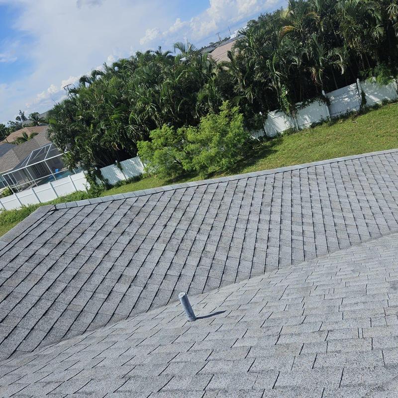 Gray asphalt shingle roof with vent pipe in Florida