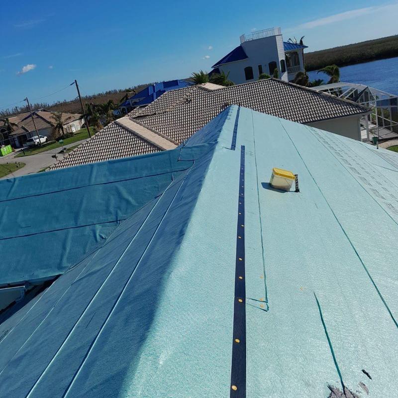 Roof underlayment installation on canalfront home in Cape Coral