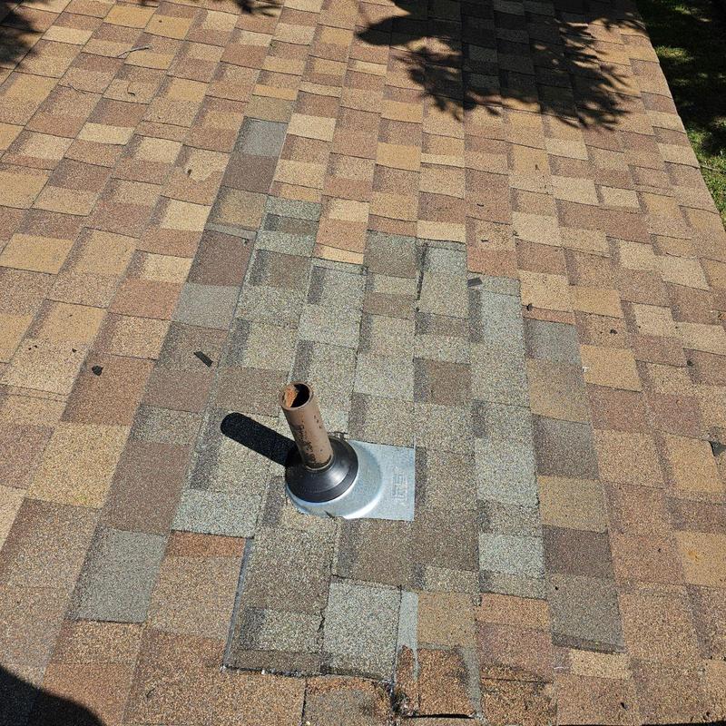 Roof vent flashing with new composite shingles installed