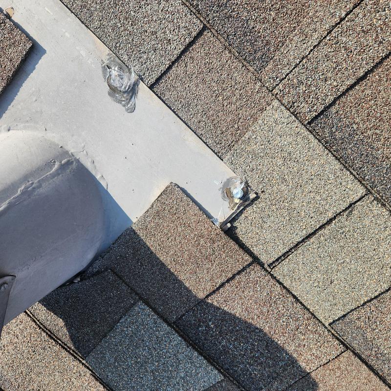 Roof fasteners with caulk seal on asphalt shingles