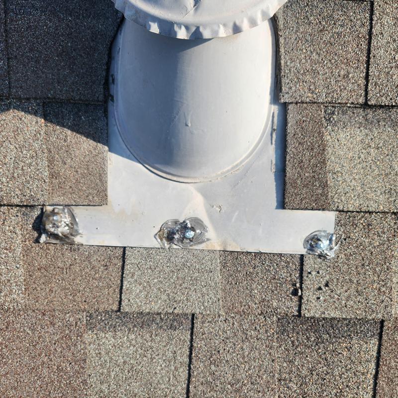 Roof vent flashing with sealed exposed fasteners on shingles