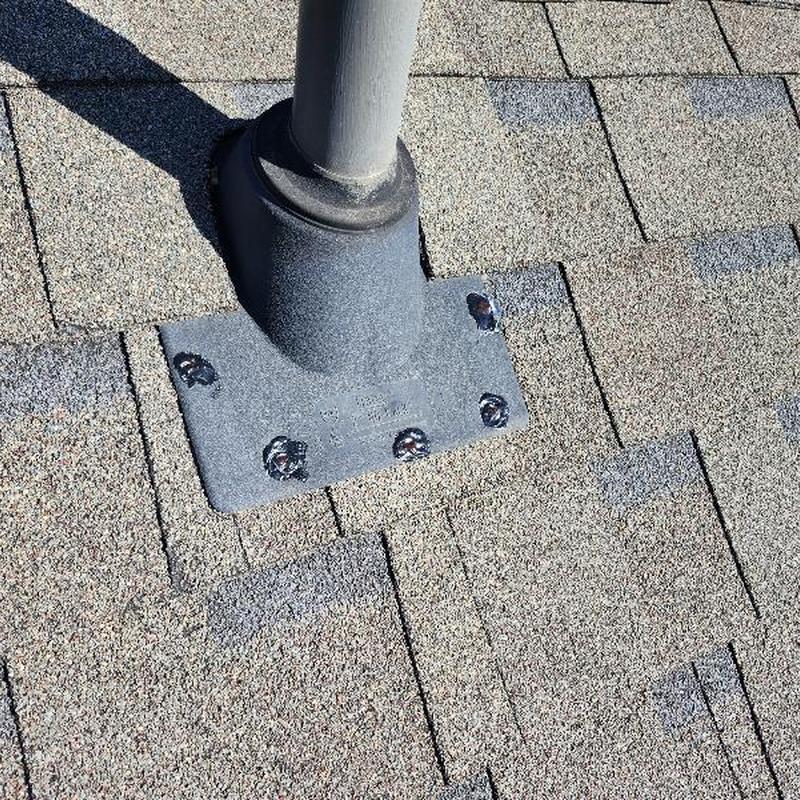 Roof pipe flashing with sealed exposed fasteners on shingles
