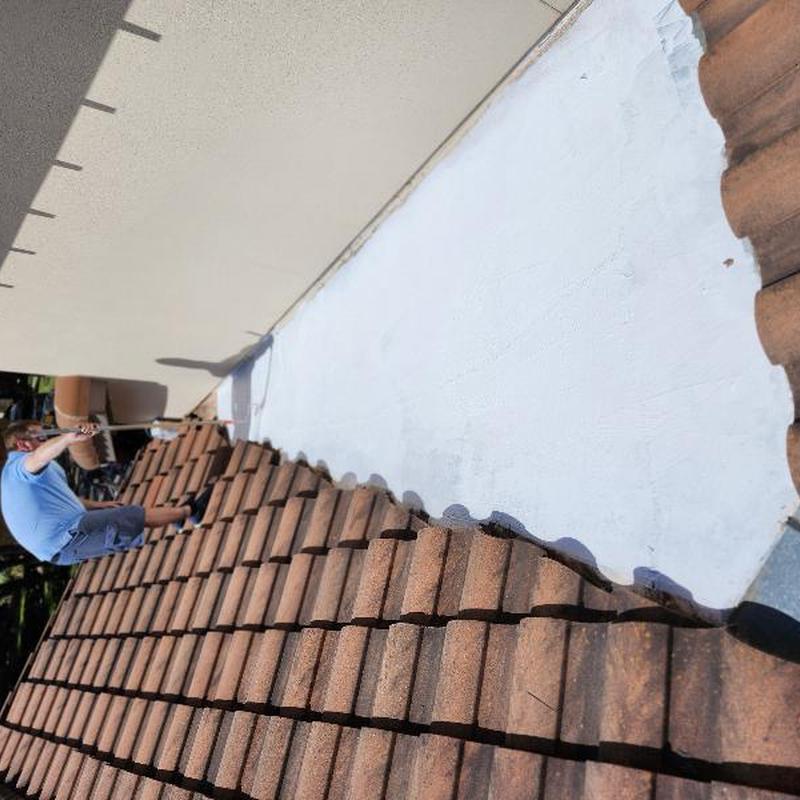 Valley metal painting on clay tile roof in Austin, TX