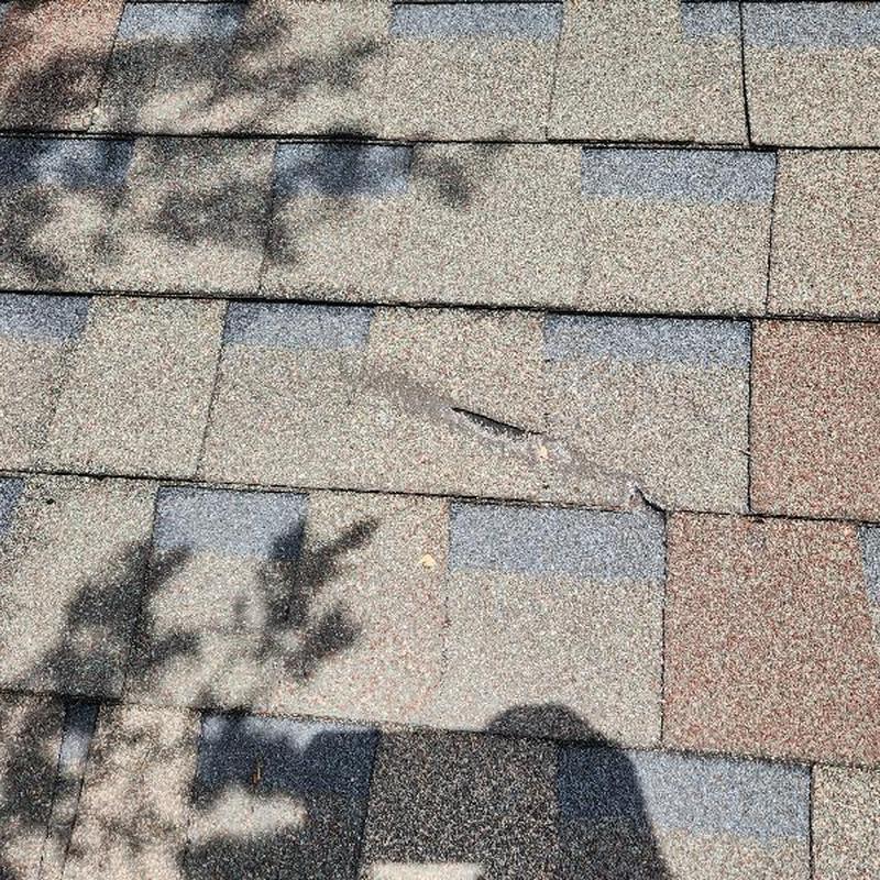 Owens Corning Driftwood shingles with surface damage