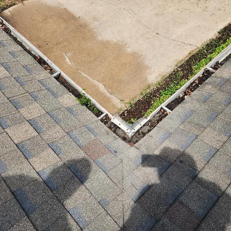 Owens Corning Driftwood shingles and gutter corner detail