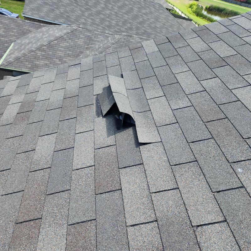 Royal Sovereign shingle lifting on residential roof