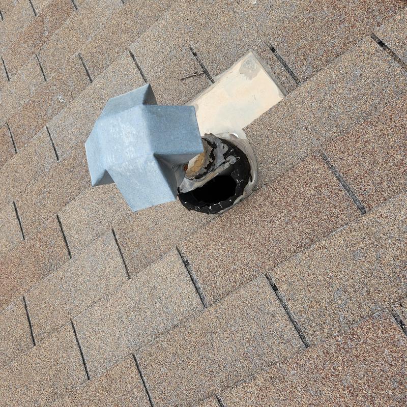 Roof vent pipe flashing with visible sealant repair Roof vent pipe flashing with visible sealant repair