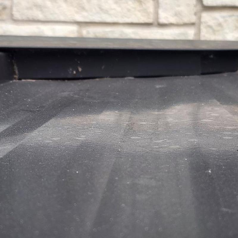 Standing seam metal roof gap at head wall flashing