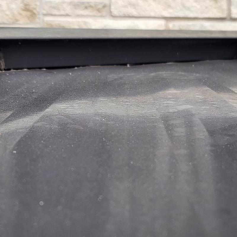 Standing seam metal roof head wall flashing gap close-up