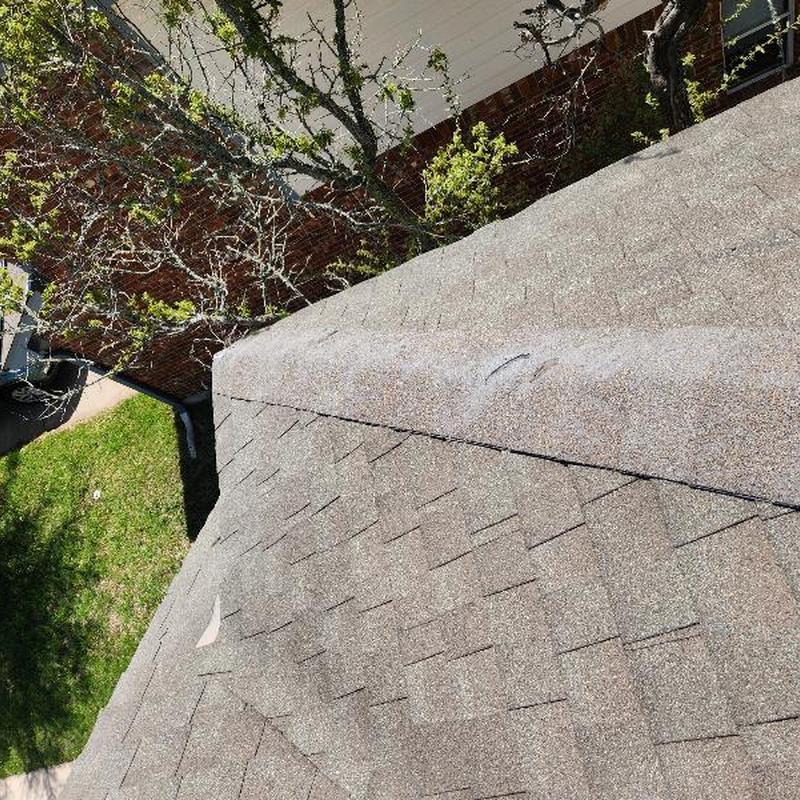 GAF Weather Gray hip shingles installation on roof
