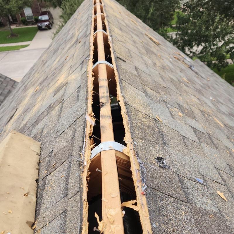 Ridge vent system installation on residential roof