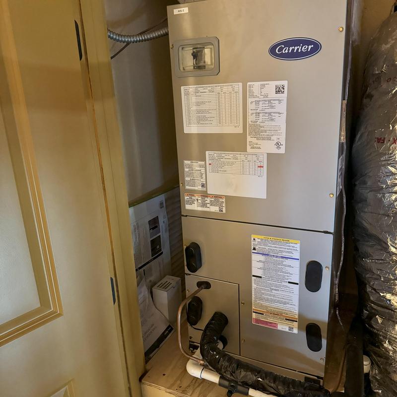 Carrier HVAC air handler unit in attic space