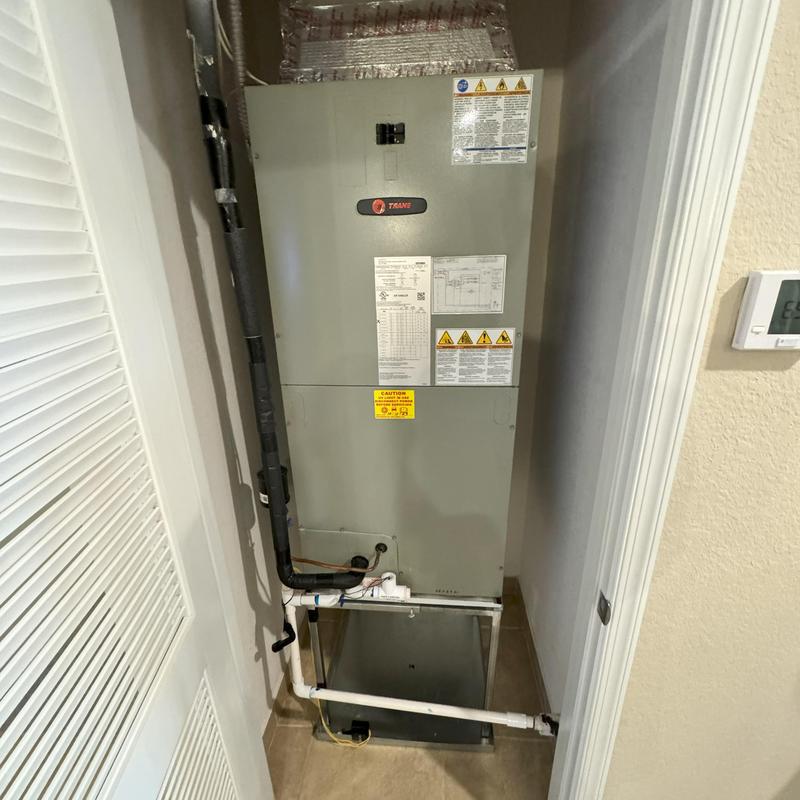 Trane central air handler with insulated piping