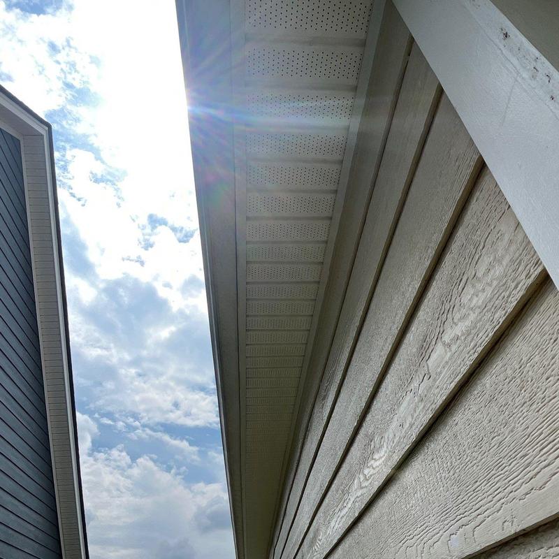 Roof soffit and fascia inspection on house exterior