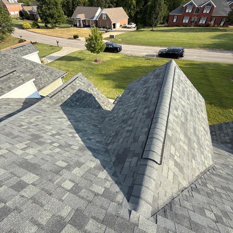 Asphalt shingle roof with dormer in suburban neighborhood